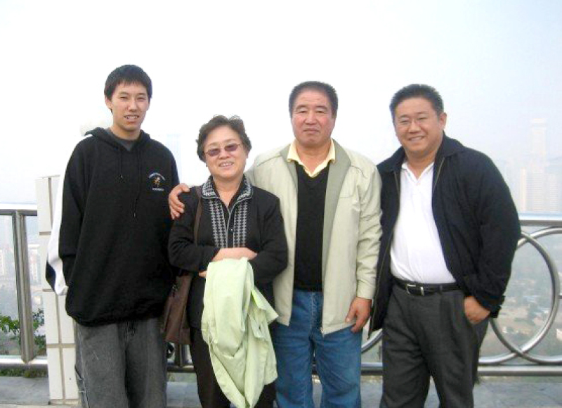 Kenneh with his parents and son