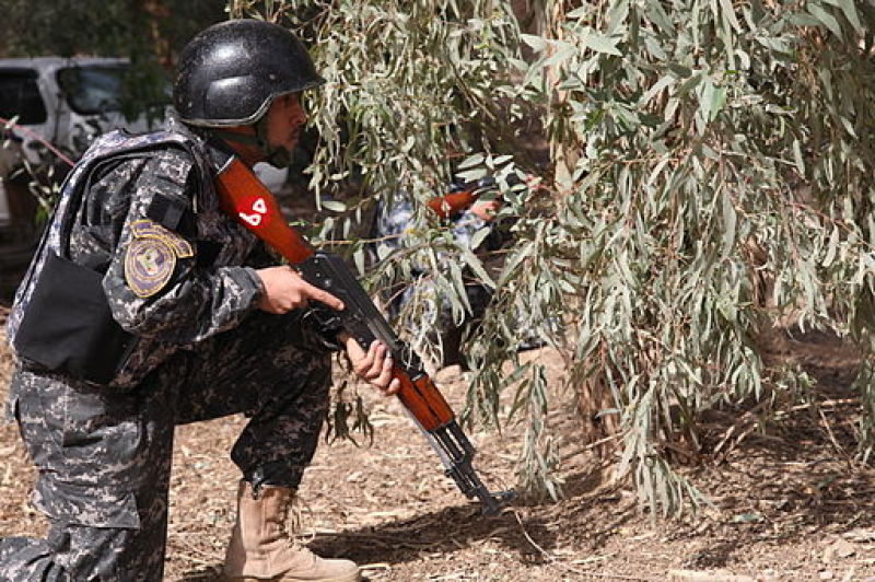 Iraqi policeman with an AK47 rifle 