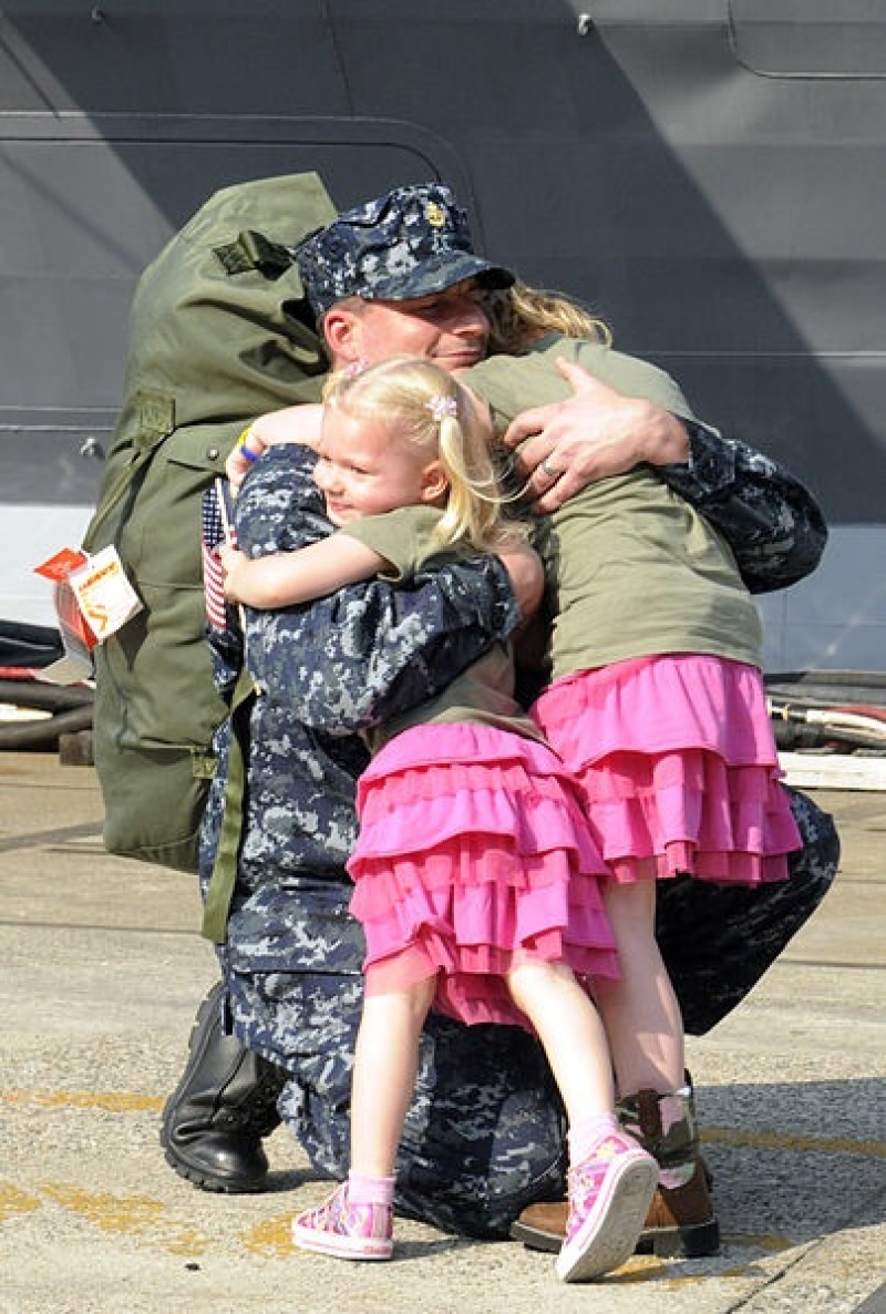 Officer Marc De St. Aubin Hugs His Daughters
