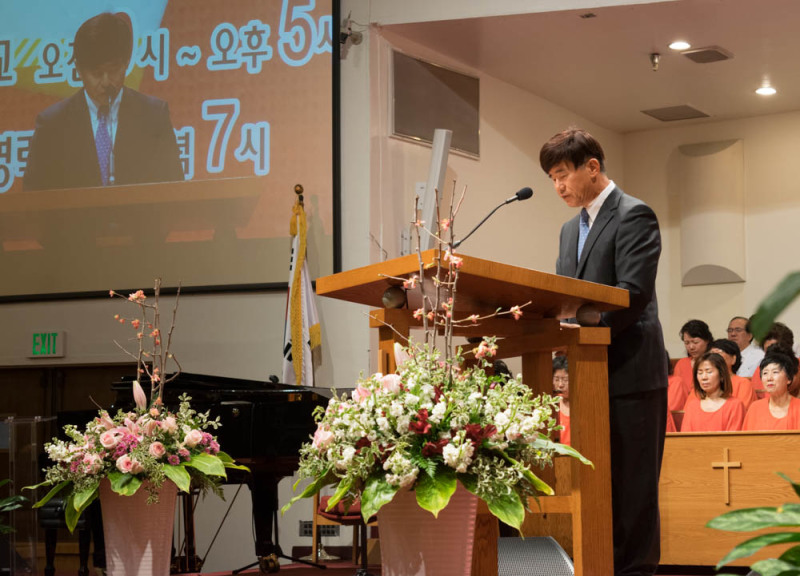 Rev. Sam Shin led a largely Korean-speaking crowd of 400 in prayer to open a worship service after a world education missions conference at Young Nak Presbyterian Church on February 1, 2018. Shin led 