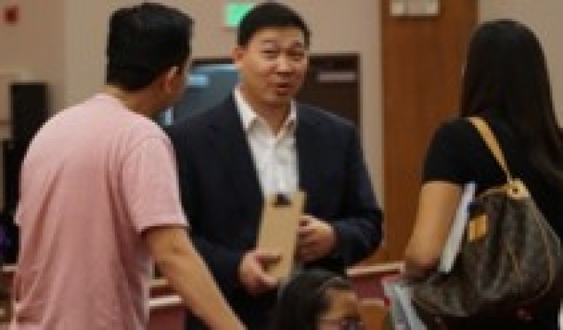 Pastor Andrew Park speaks with his members of his congregation