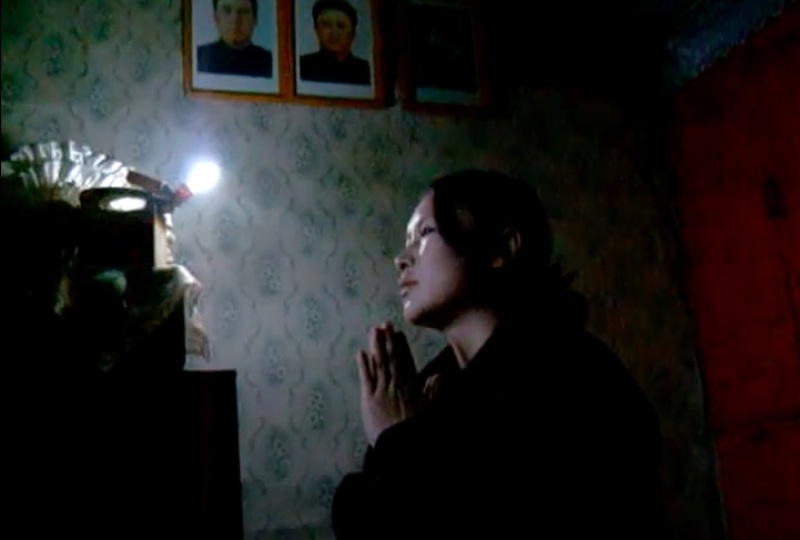 N.Korea Woman Praying