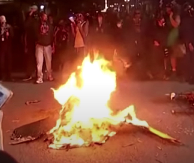 Protesters burn bible in Portland 