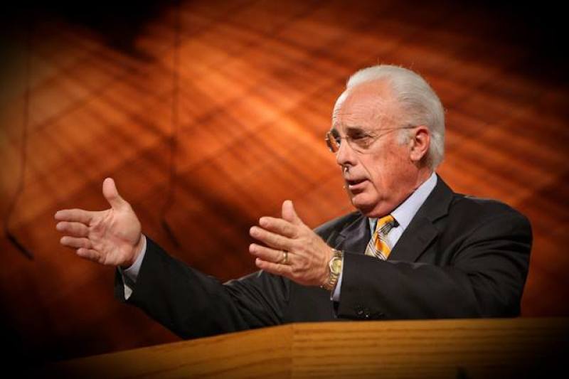 Pastor John MacArthur giving a sermon to his congregation