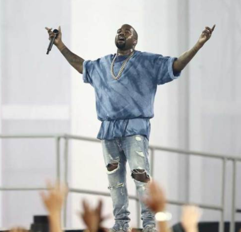 Kanye West performs at a ceremony and thanks the Lord. 