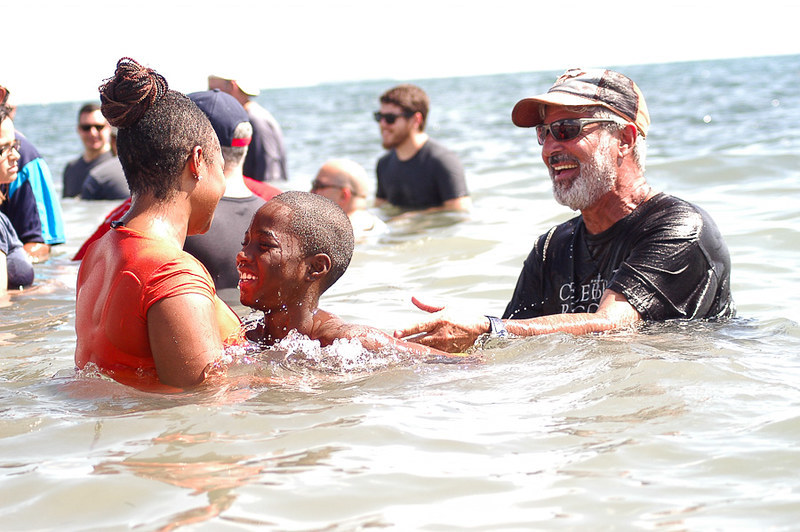 People gather for Calvary Chapel Church’s annual outdoor baptism at Newport Beach’s Corona Del Mar State Beach on Saturday, September 12, 2020