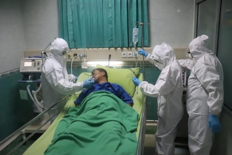 Man treated by nurses in hospital
