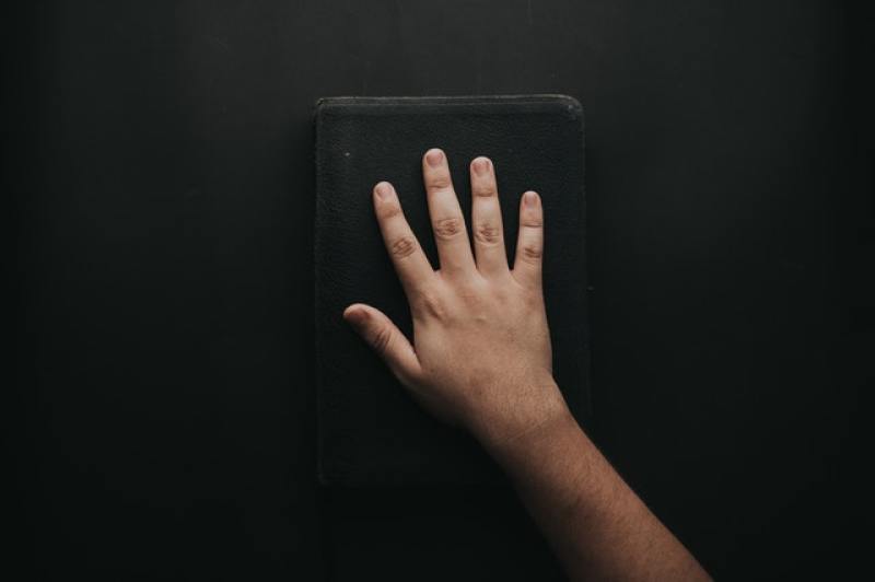 hand on Bible