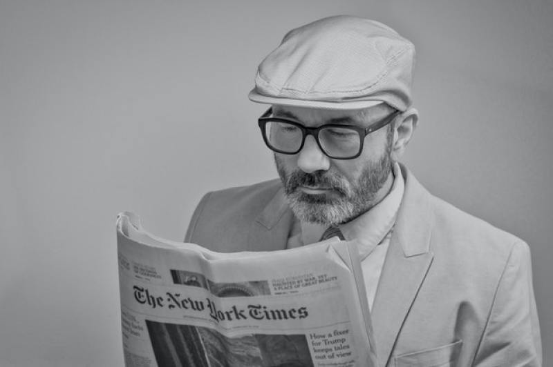 Man reading New York Times