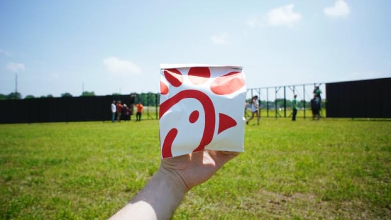 Person holding pack of food from Chick-fil-A