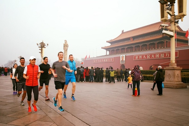 Mark Zuckerberg running through Tiananmen Square in 2016