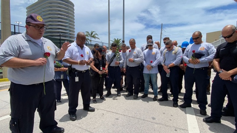 Miami-Dade Chaplain & firefighters praying