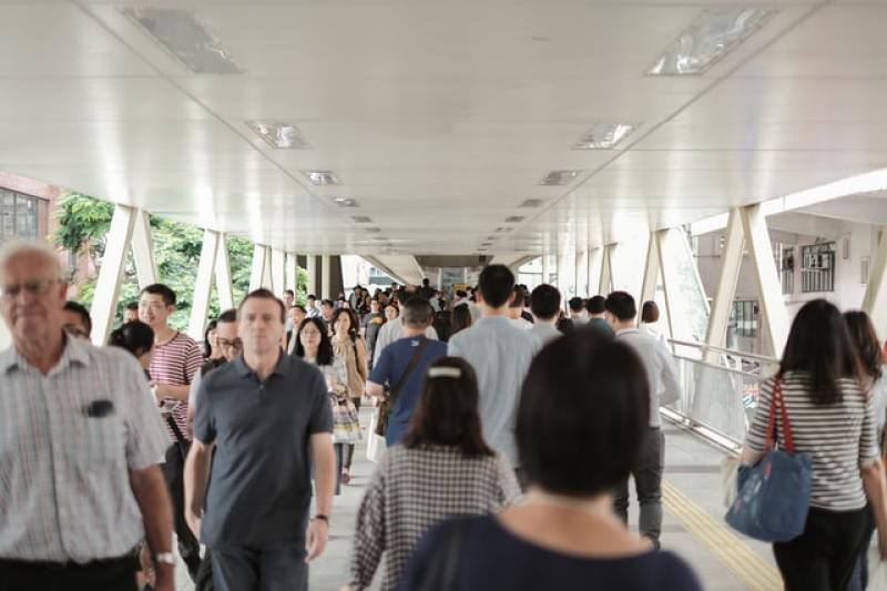 crowded foot bridge at Hong Kong airport