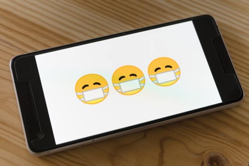 smartphone showing emojis wearing face masks