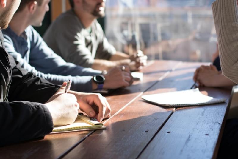 Small group of people studying the Bible together