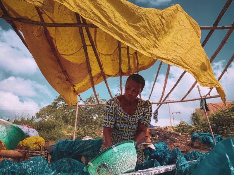 Woman in Nigeria holding a tray