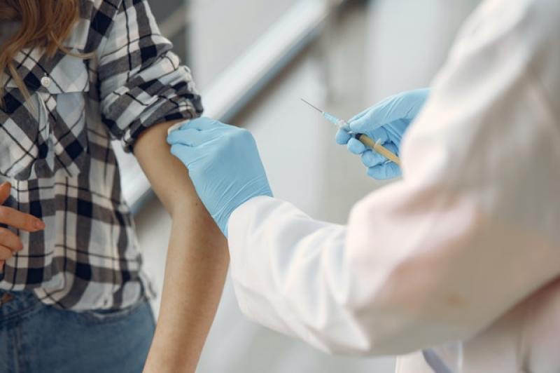 a young person getting vaccinated