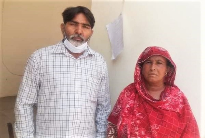 Rights worker Riaz Aasi with Christian sanitation worker Salima Rani Bibi.