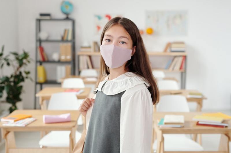female student wearing mask in school