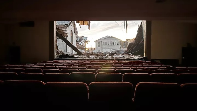 devastation caused by tornadoes as seen from inside a hall